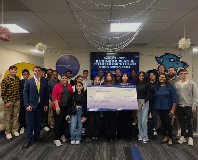 Finalists and judges at the 2025 Business Plan and Pitch Competition with Popped Up's winning check